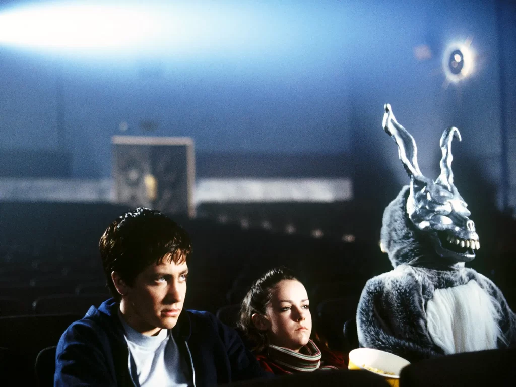 Donny, his friend and a rabbit sit in a empty movie theater.